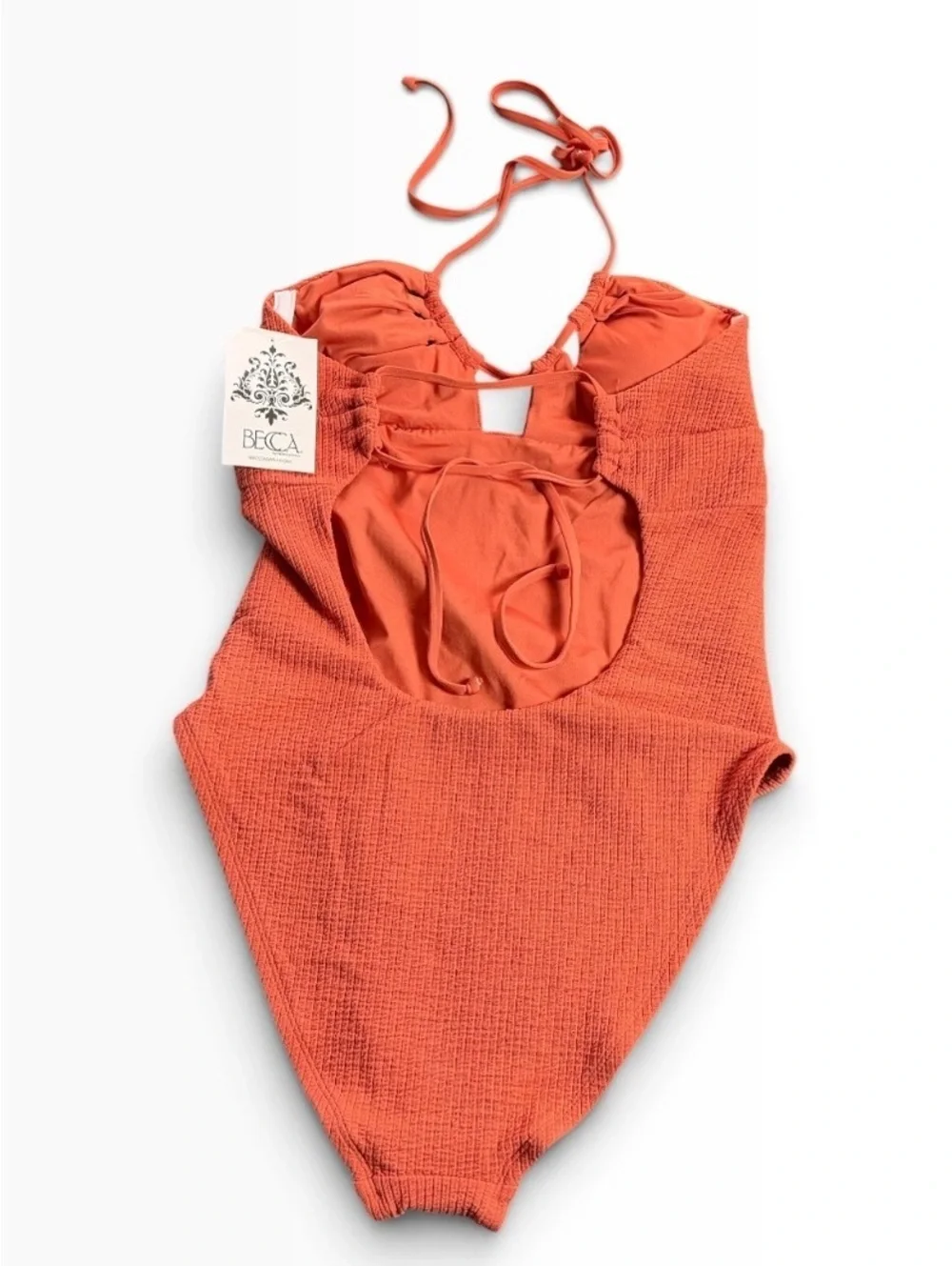 BECCA cut out textured tie back One Piece swimsuit rust orange size M $138 NWT